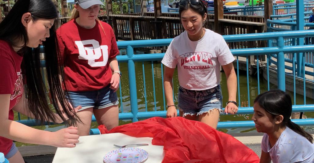 Students demonstrate experiments with kids