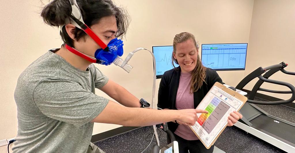 Student and professor using medical equipment