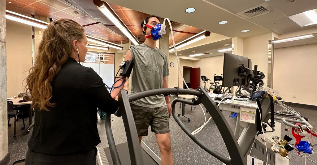 Student and professor using medical equipment