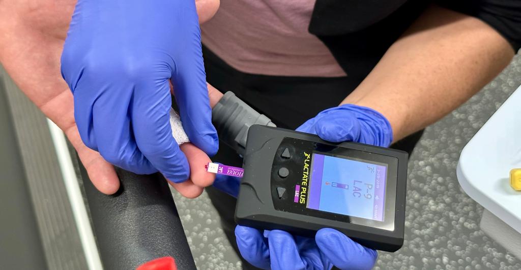 Hands meeting to use blood lactate meter