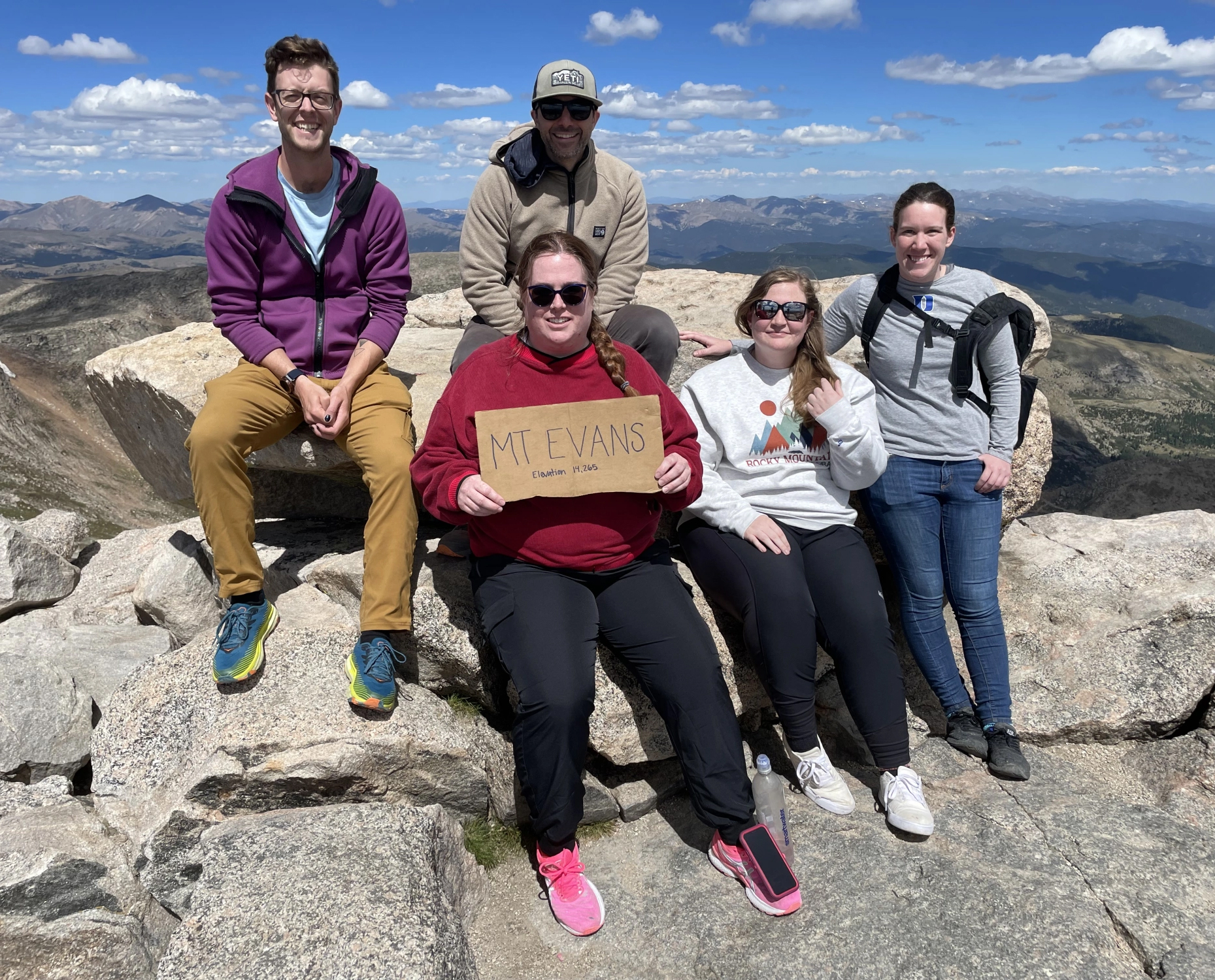 Jon Velotta and his students researchers sit at the top of Mt Blue Sky, formerly known as Mt. Evans.